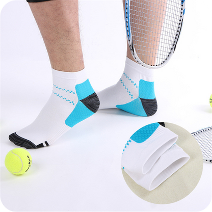 Man wearing white low-cut socks with blue heel panels while standing among tennis balls and rackets, with an inset close-up of the folded cuff. 3