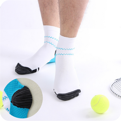 Man's feet in white ankle socks with blue dashed stripes, tennis balls and racket beside him, with a circular close-up of the heel. 2