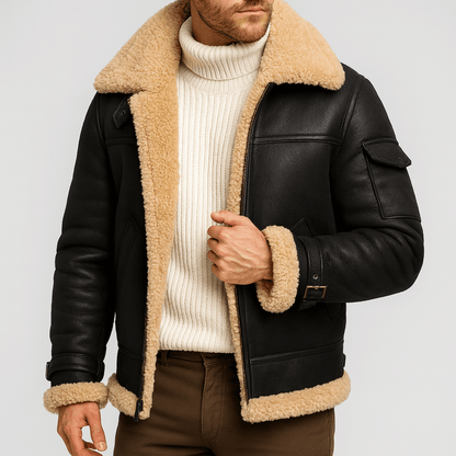 Model wearing the black leather jacket with thick shearling collar and hem, unzipped over a cream ribbed roll-neck jumper. 4