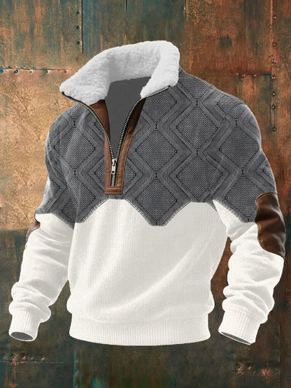 Grey and white diamond-knit version on a rusty metal backdrop, showing the zip, brown trim and elbow patches 2