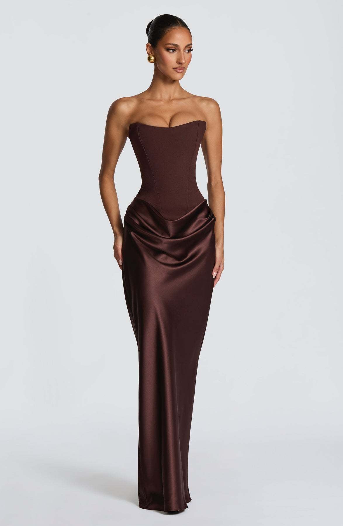 Model in the brown satin corset maxi dress, head turned to the side 13