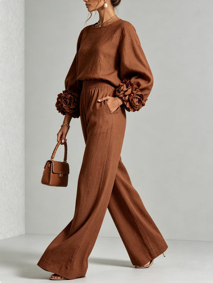 Rust brown version of the set worn by a model in side profile, one hand in pocket 5