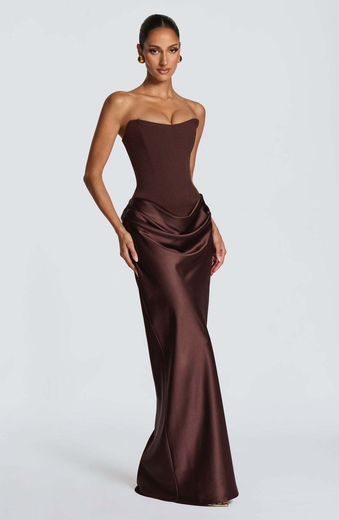 Chocolate brown strapless corset dress at a three-quarter angle with satin hip drape 12