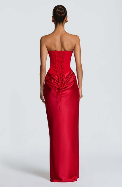Back view of the red dress showing the corset lacing and draped satin below the waist 28