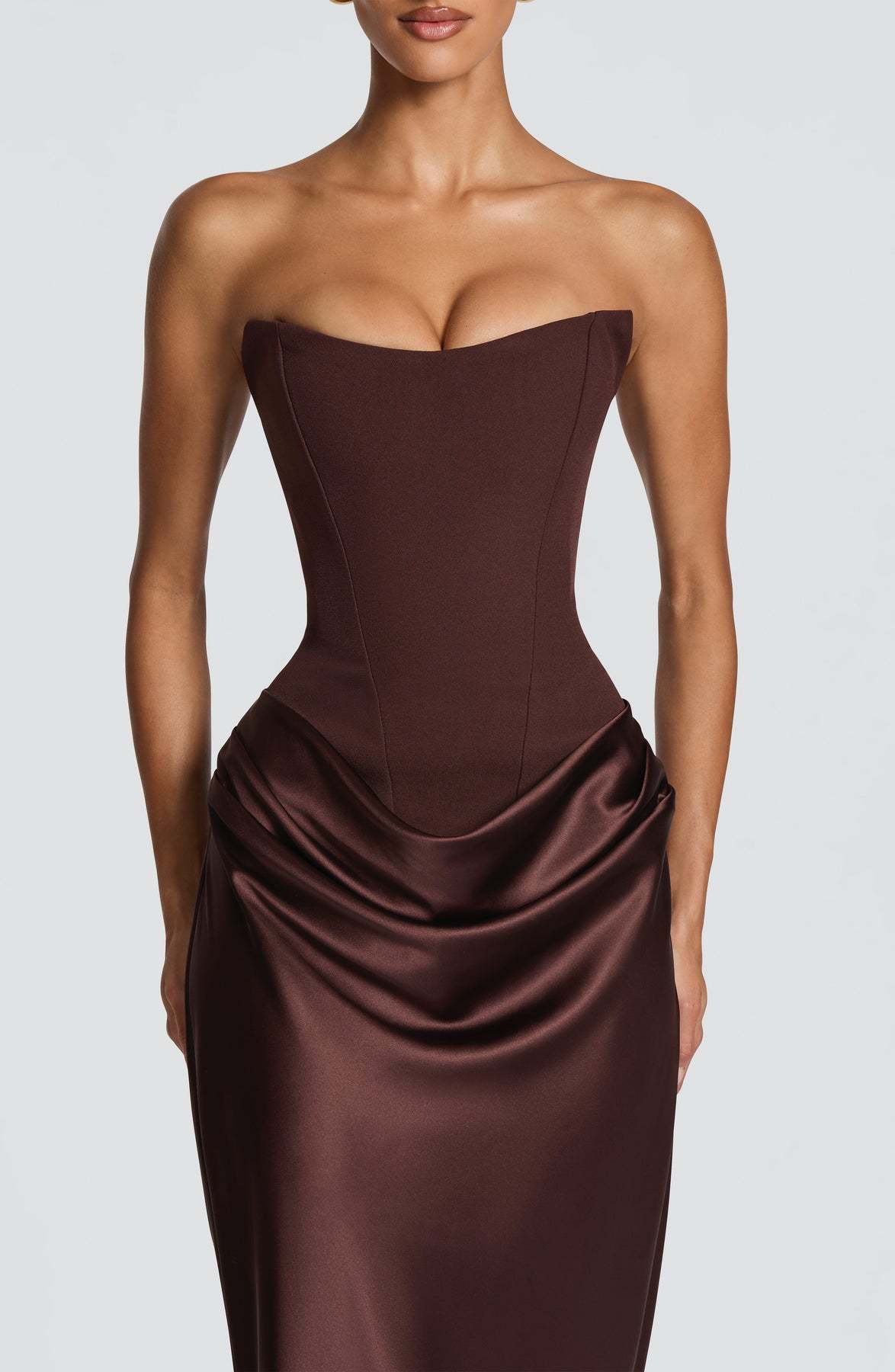Brown corset maxi dress front view, hands by sides, showing full-length satin skirt 14
