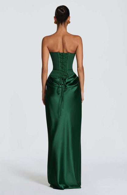 Back view of the emerald green dress showing the corset lace-up back and trailing ties 3