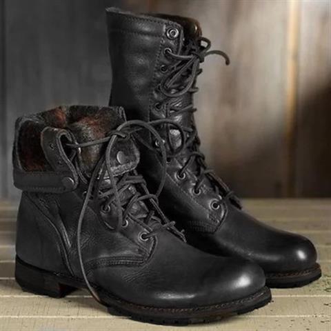 Pair of black leather lace-up boots, one with its cuff folded down to show a patterned fabric lining. 2