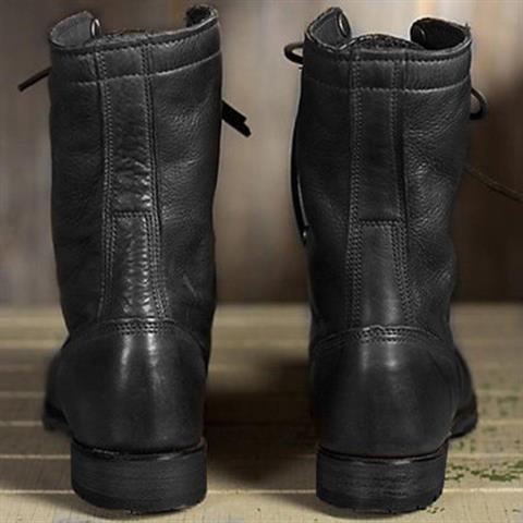 Rear view of a pair of black leather boots showing the stitched back seam, pull tabs and low block heels. 4
