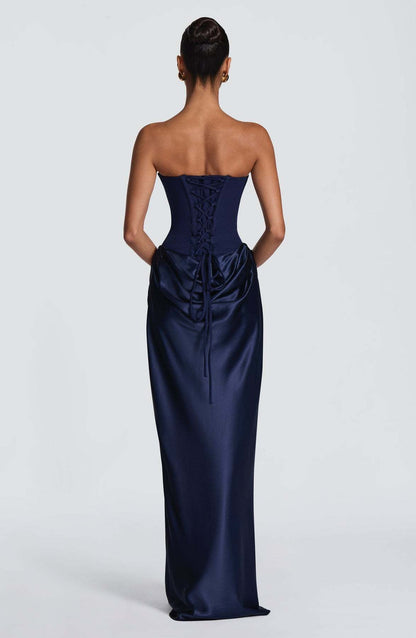 Back view of the navy dress showing the corset lacing and long ties over the satin drape 7