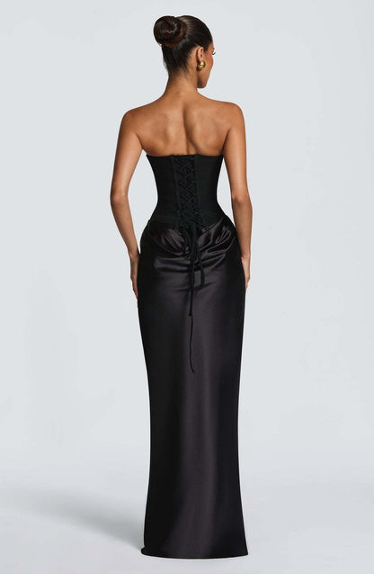 Back view of the black dress showing the corset lace-up fastening and trailing ties 23
