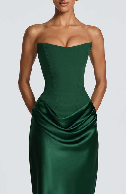 Close-up of the emerald green corset bodice, seaming and draped satin at the hips 4