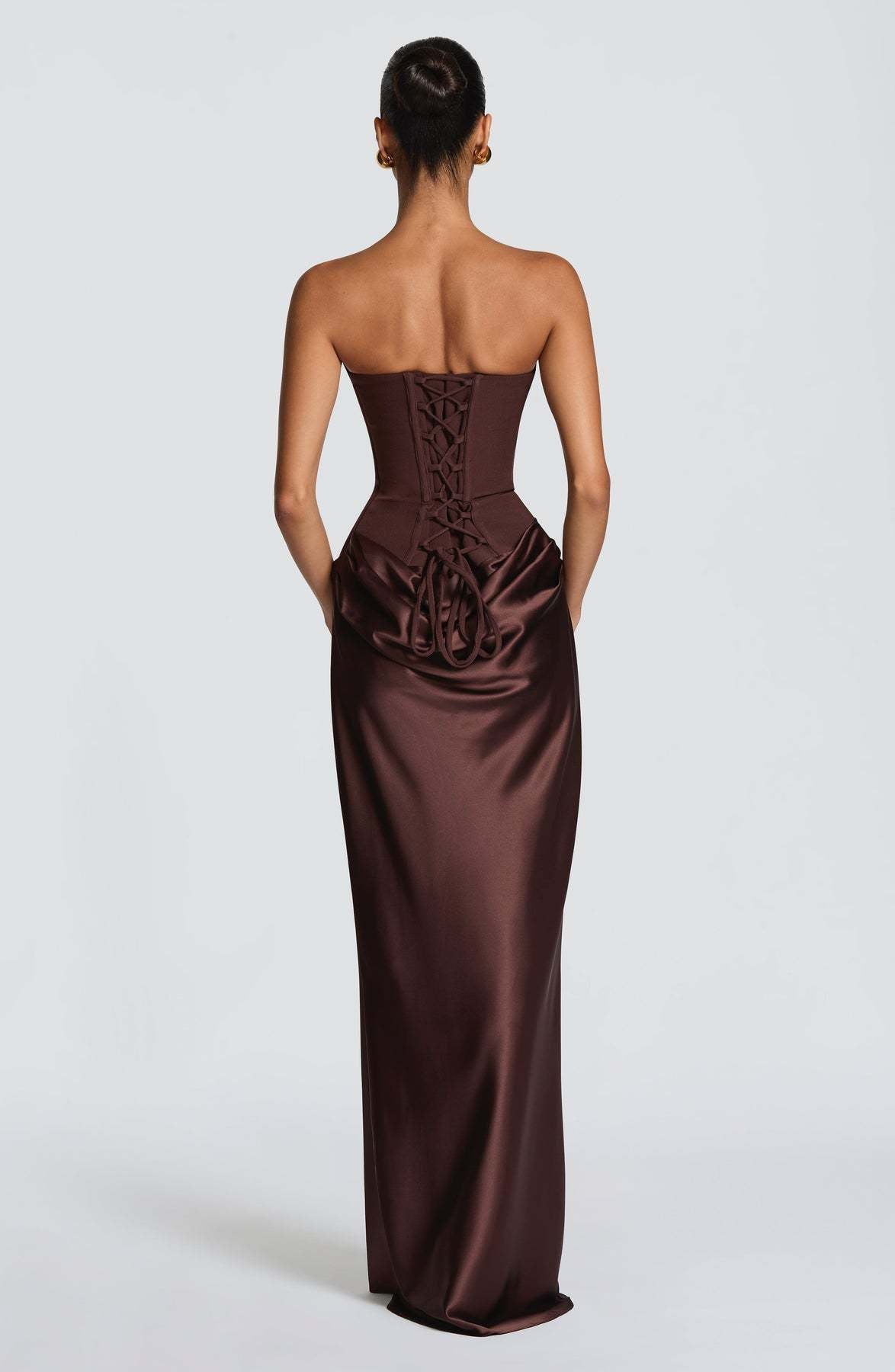 Back of the chocolate brown dress with corset lace-up and looped ties at the waist 11