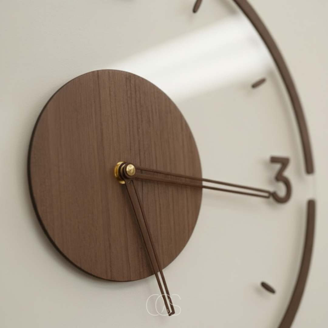 Close-up at an angle of the wooden centre disc, brass pivot, slim hands and raised numeral three 2