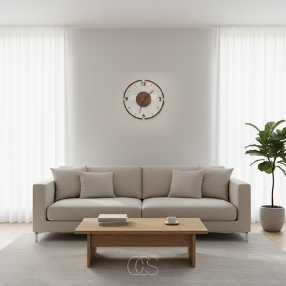 Clock centred on a light wall above a beige sofa with cushions, oak coffee table and tall plant 6
