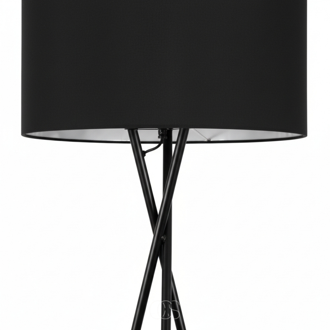 Close-up of the black fabric drum shade and crossed black metal legs on white 4