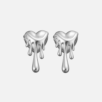 Pair of silver-tone melting heart stud earrings with polished drips, shown from the front on a plain light background. 3