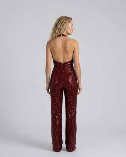 Back view of the burgundy sequin jumpsuit showing the open back, halter fastening and zip 26