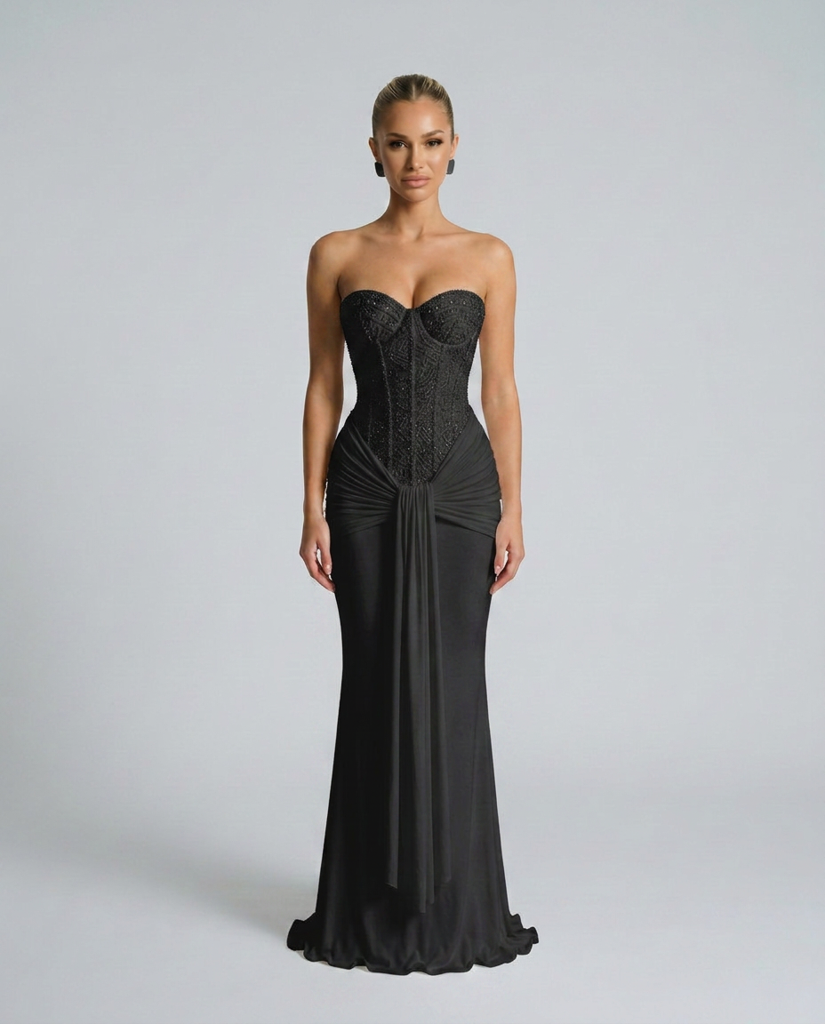 Model wearing the black beaded corset maxi dress, facing the camera, with draped front panel 1