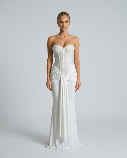 Model facing forward in the white pearl-beaded corset maxi dress with a draped waist panel 6