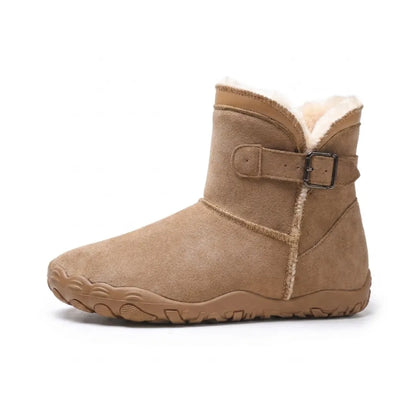 Side view of a single tan suede ankle boot with cream fleece lining and buckled strap 19