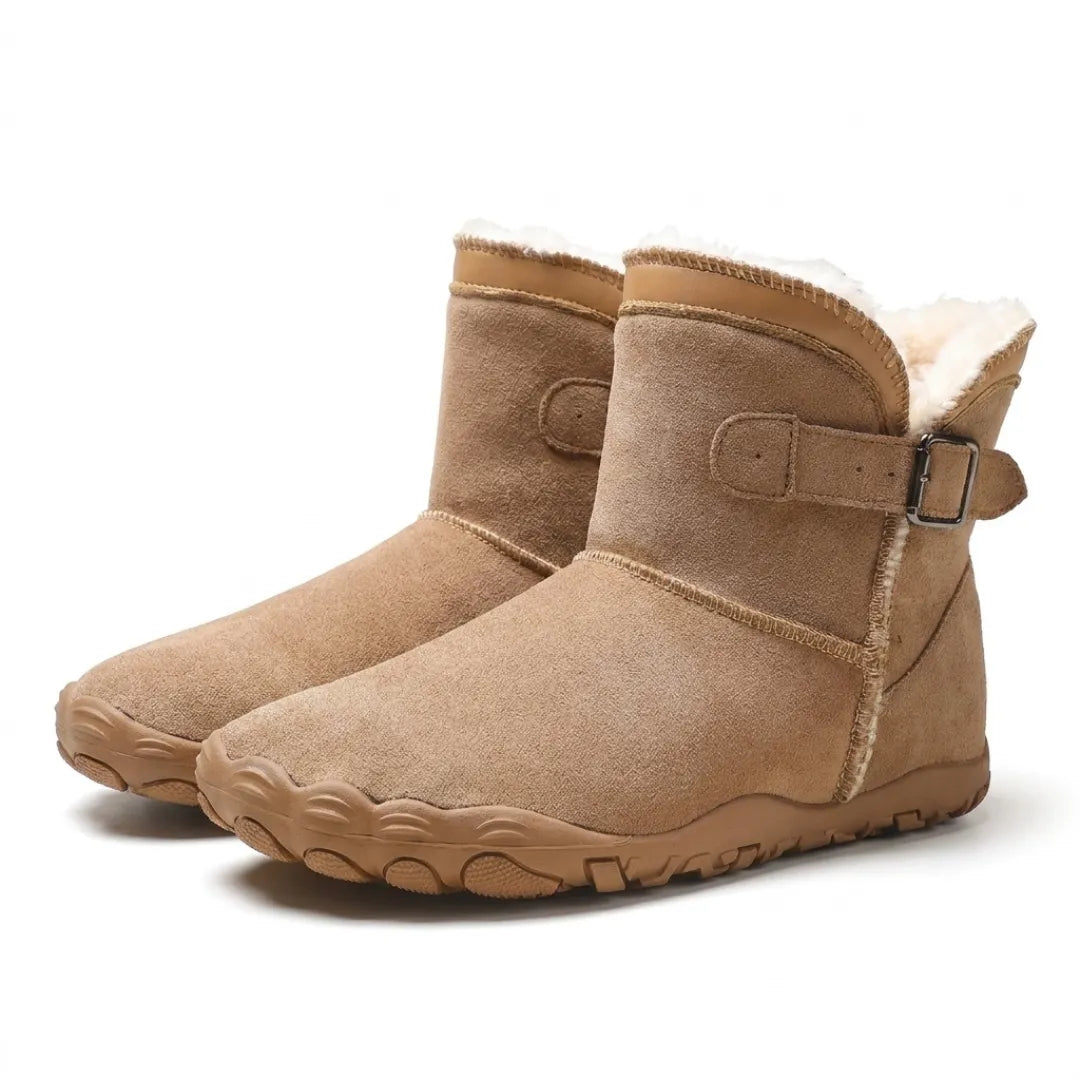 Pair of tan suede ankle boots with buckle straps, cream fleece lining and wide-toe treaded soles 25