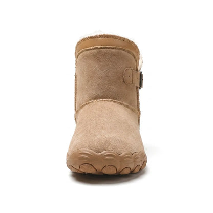Front view of a tan suede boot showing the broad rounded toe, fleece collar and side buckle 26