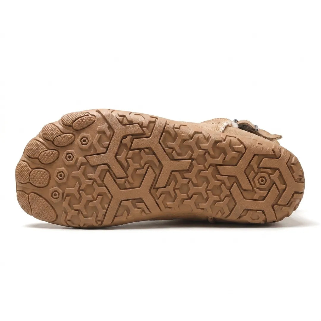 Underside of a tan boot showing the patterned tread and separate toe pads on the sole 27