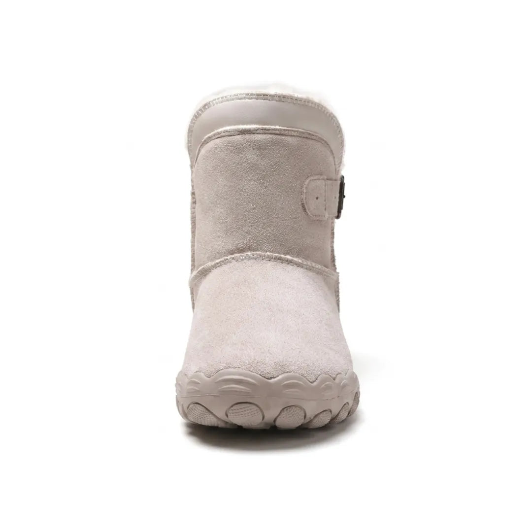Front view of a beige-grey suede boot showing the broad rounded toe, fleece collar and side buckle 35