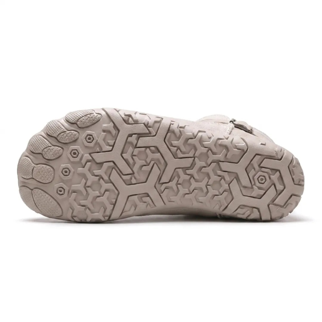 Underside of a beige-grey boot showing the geometric tread pattern and separate toe pads 36