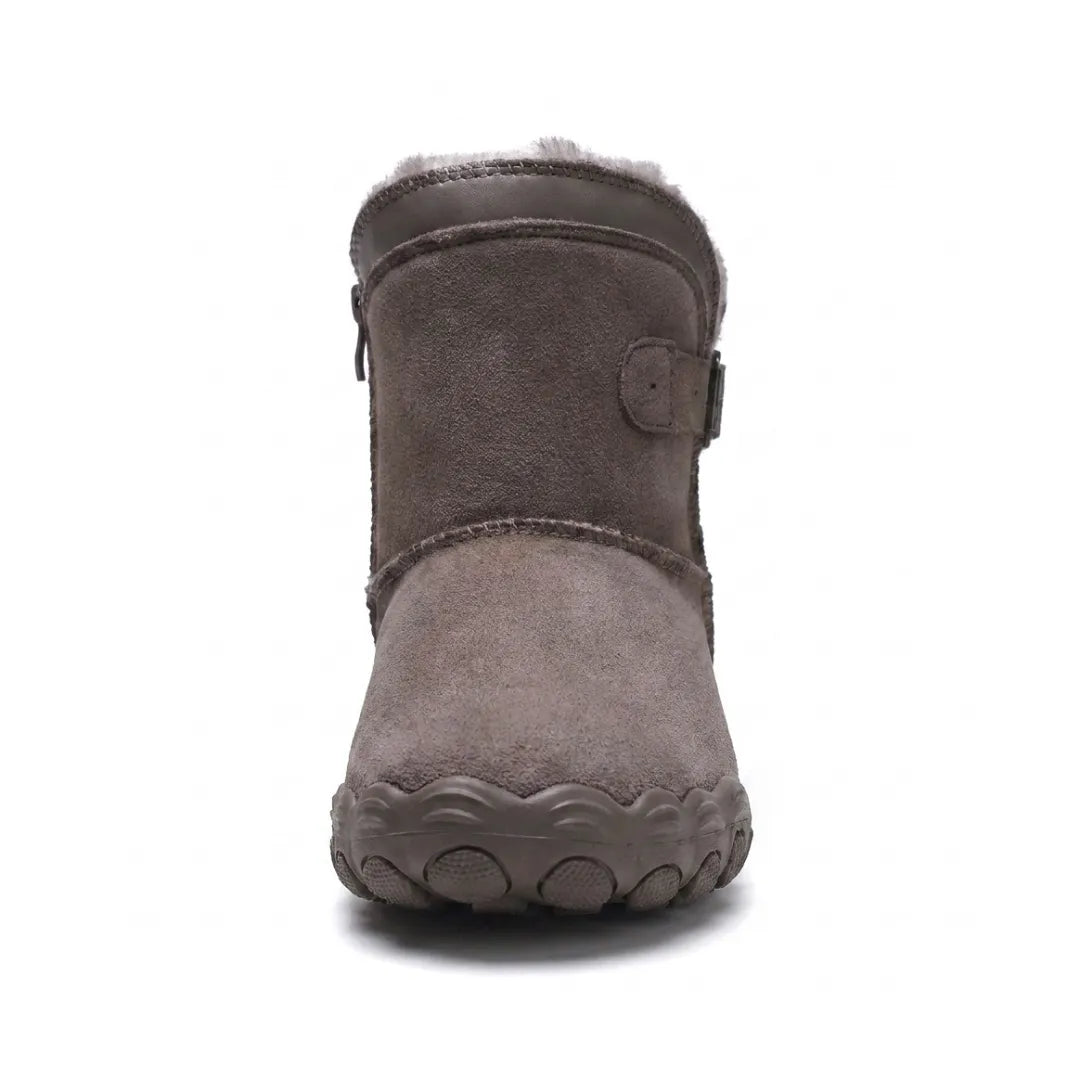 Front view of a taupe suede ankle boot showing the broad rounded toe, fleece collar and side zip 44