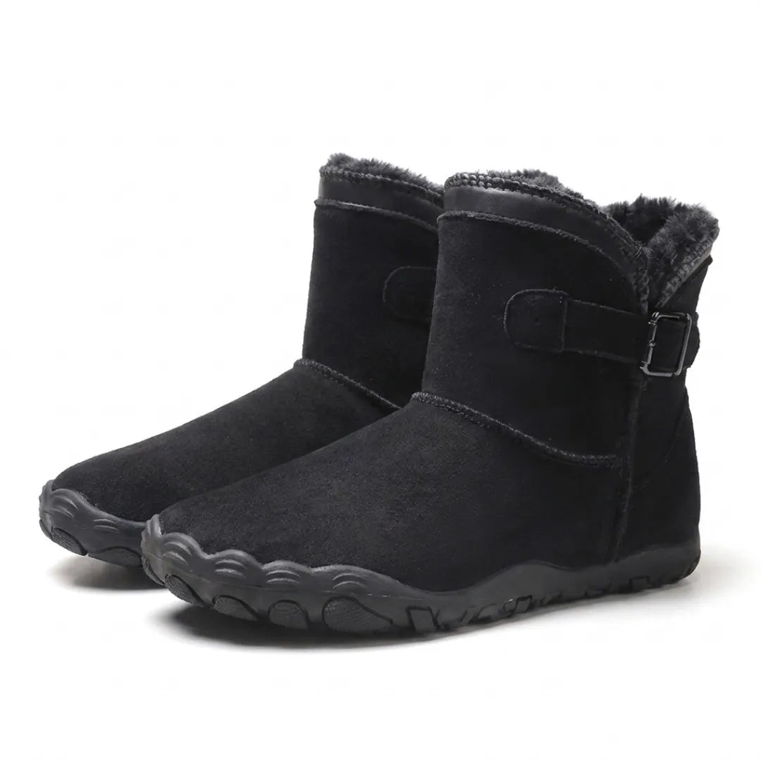 Pair of black suede boots with dark fleece lining, buckled strap and wide, flexible sole 16