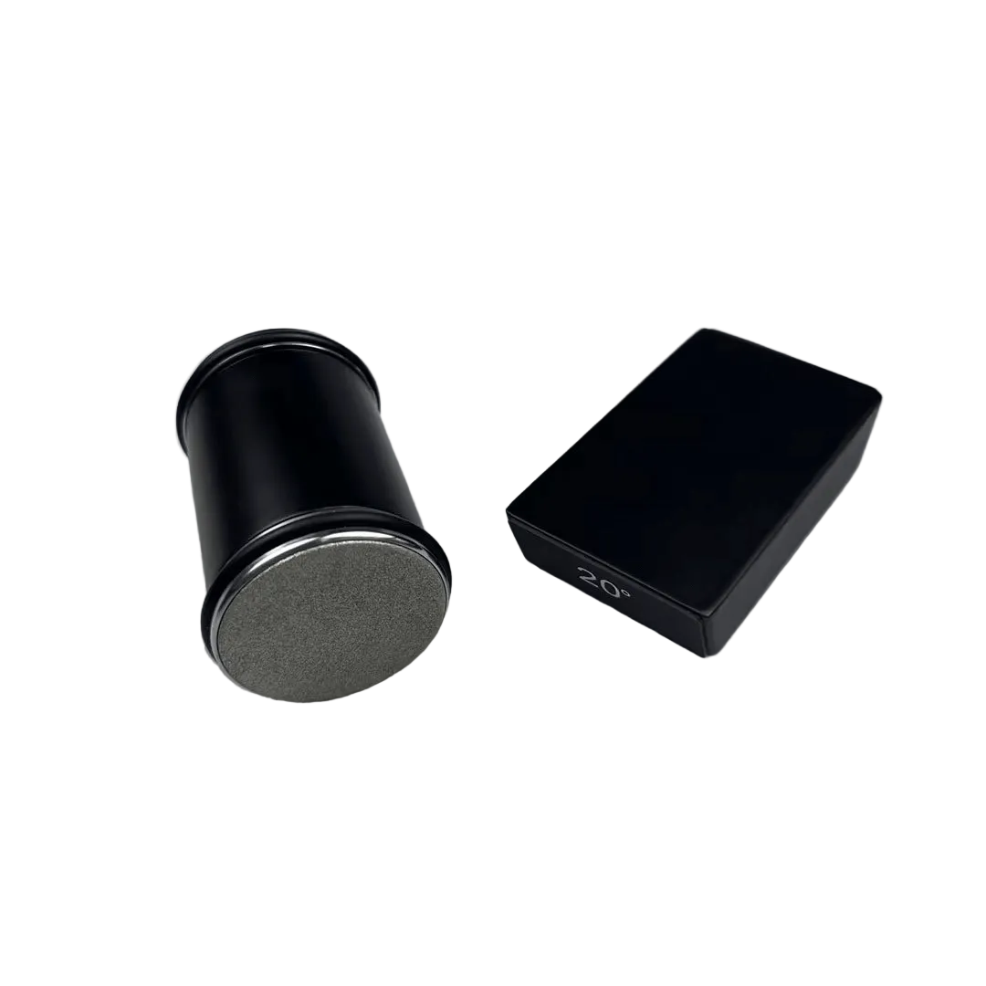 Black cylindrical roller with a grey diamond-coated disc facing forward, beside a matching black angle block marked with its angle, on white. 1