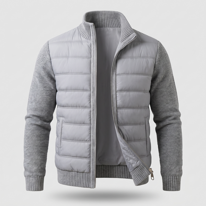 Light grey jacket laid flat from the front, zip partly open, showing quilted body and knitted sleeves 3
