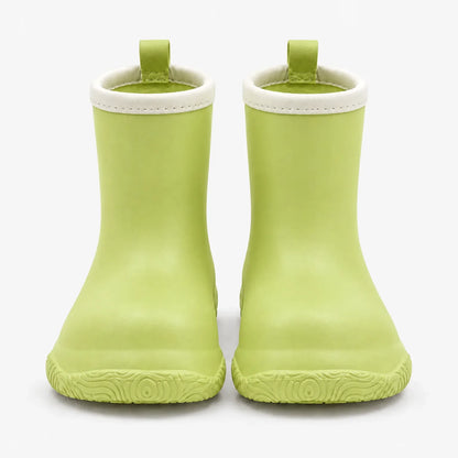 Pair of light green wellies from the front, with cream collars, matching pull loops and a swirl-patterned sole. 7