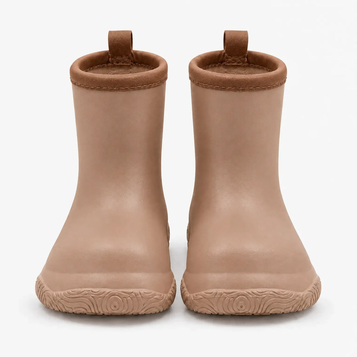 Front view of a pair of tan wellies with darker brown collars and pull loops above a swirl-patterned sole. 8
