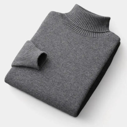 Folded roll-neck jumper in charcoal grey, with the ribbed collar and one cuff showing 3