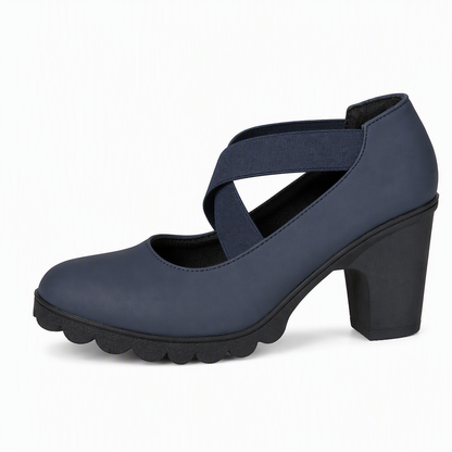 Single navy matt block heel Mary Jane with crossed elastic straps and treaded black sole, seen from the side on white. 11