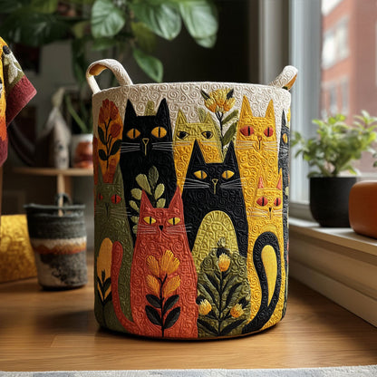 Quilted basket with a colourful cat and flower design and two cream handles, standing on a wooden floor beside a sunny window. 1