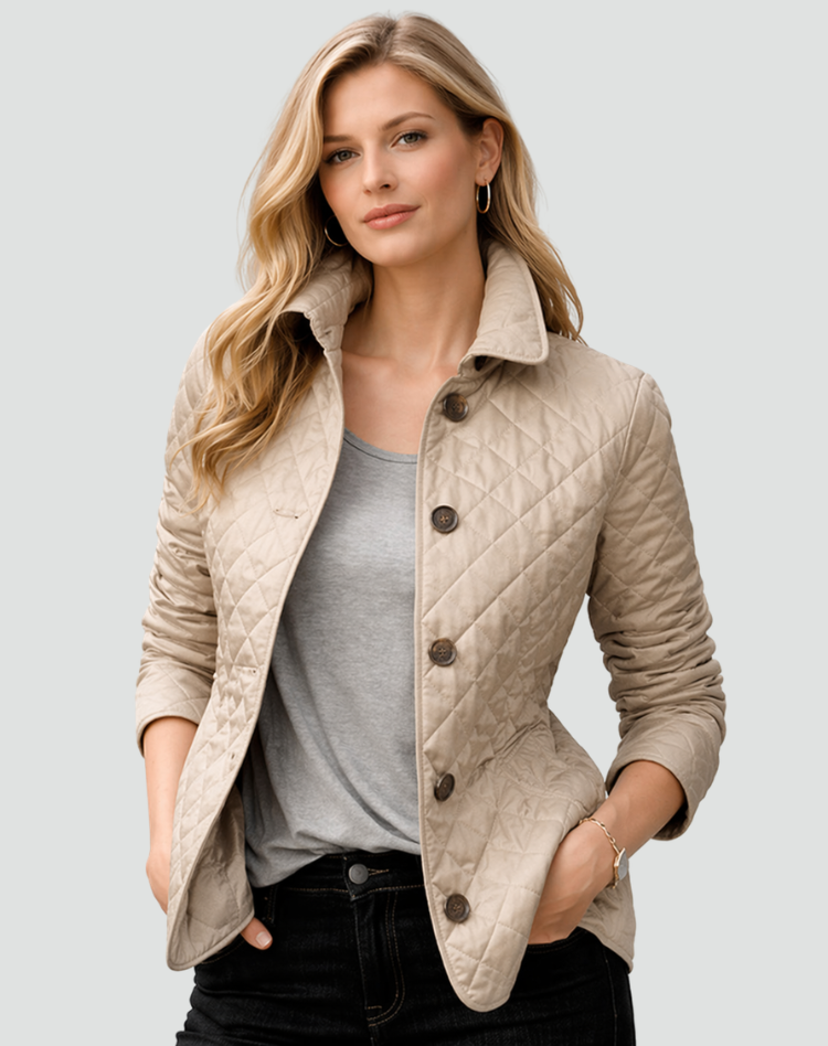 Model wearing the beige quilted jacket with brown buttons over a grey t-shirt and black jeans, hands in pockets. 3