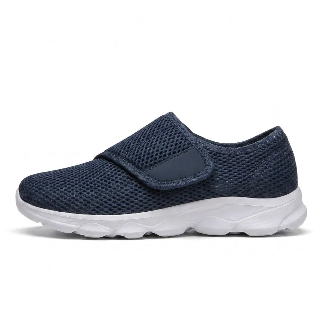 Side view of a navy mesh shoe with a wide hook-and-loop strap over the instep and a white sole. 1