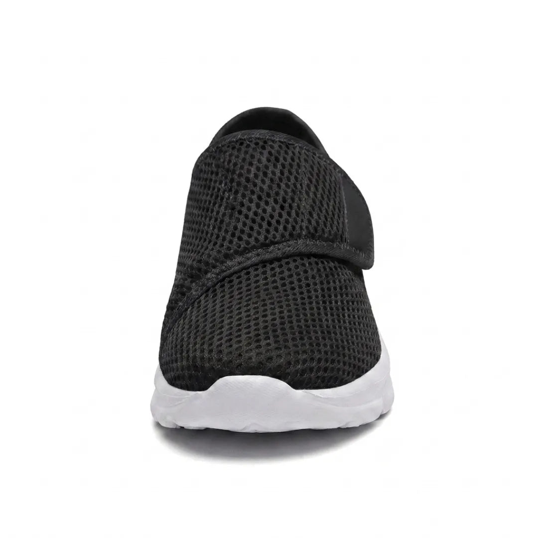 Front view of a black mesh shoe showing the wide toe box and hook-and-loop strap over the instep. 26