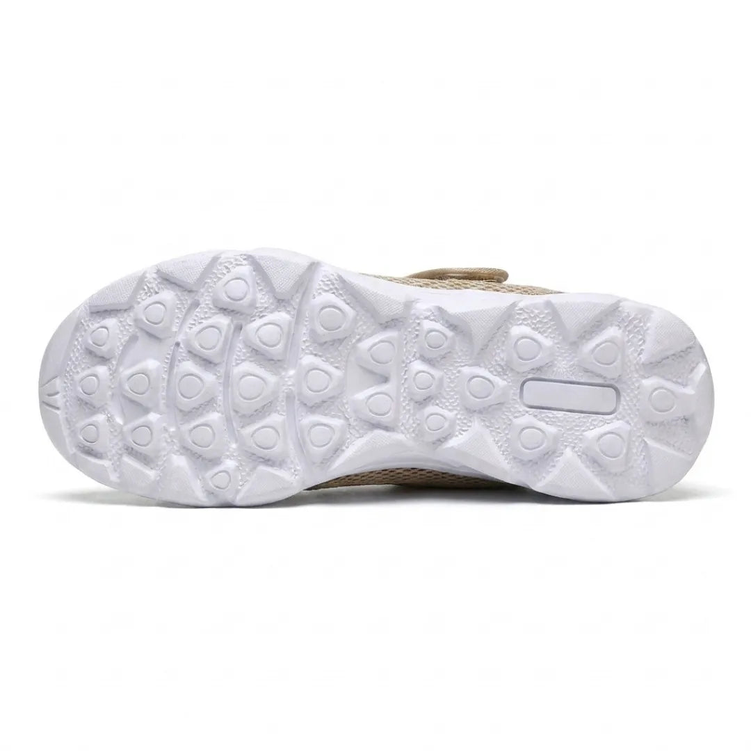 White sole of the beige shoe seen from underneath, showing the grippy pattern of rounded triangular studs. 36