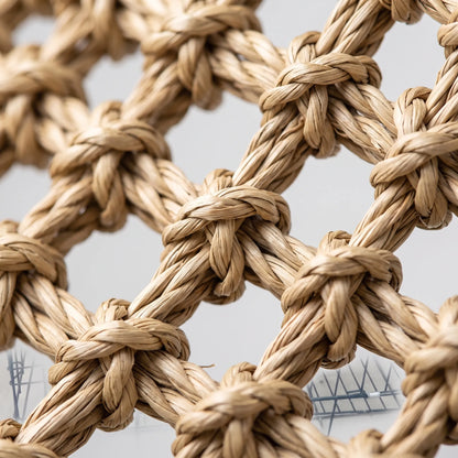 Close-up of the knotted, twisted natural fibre weave, showing the open mesh pattern and rope-like texture of the hammock. 3