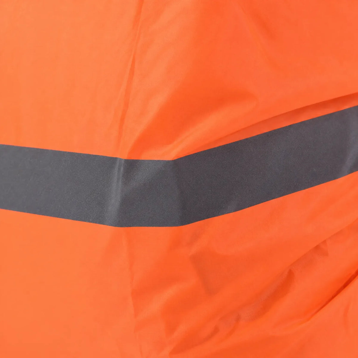Close-up of an orange cover fabric with a grey reflective strip running across it, showing the surface texture. 5