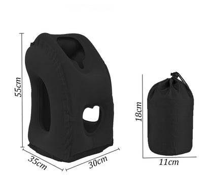 Black inflated upright pillow with openings, shown with dimension lines beside its small black drawstring storage pouch. 2