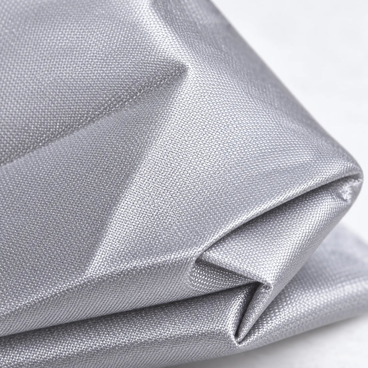Close-up of the grey fabric folded over, showing its fine woven texture and slightly glossy finish. 5
