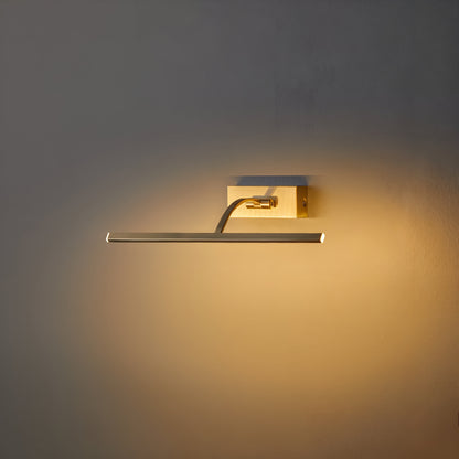 Switched-on brass picture light seen at an angle, its curved arm reaching out from the wall plate 3