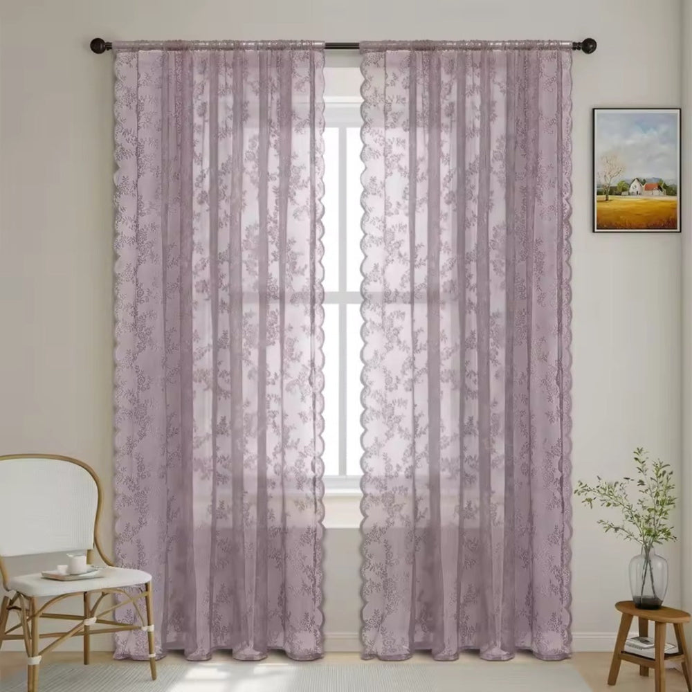 Pair of dusty mauve floral lace curtain panels with scalloped edges hung on a dark rod at a window. 11