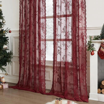 Deep red floral lace curtain panels with scalloped edges at a window in a room decorated for Christmas. 2