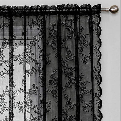 Close-up of the gathered rod pocket top of a black lace curtain on a silver rod with a round finial. 4